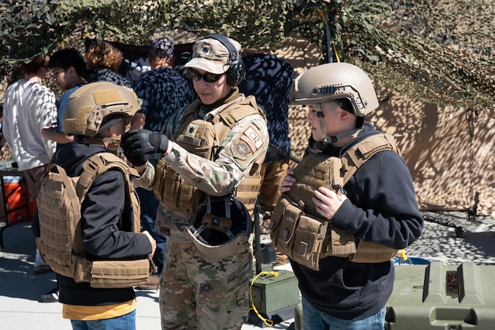 children wearing flack vests and helmets