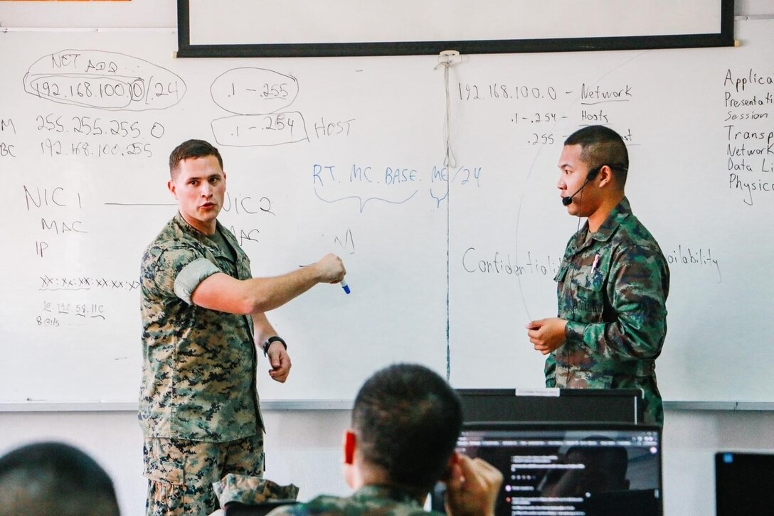 U.S. Marine Corps Capt. Eric E. Jacobs, cyberspace operations officer, III Marine Expeditionary Force Information Group, instructs a class on computer networks and subnetting during a subject matter expert exchange between Pacific Marines and Royal Thai military cyber personnel in Sattahip, Thailand, Feb. 19-23, 2024. The exchange represents a crucial step forward in advancing defensive cyber operations and fostering stronger partnerships with our Allies in the Indo-Pacific region. (Courtesy photo by Public Affairs personnel of the Royal Thai Marine Corps Headquarters base)