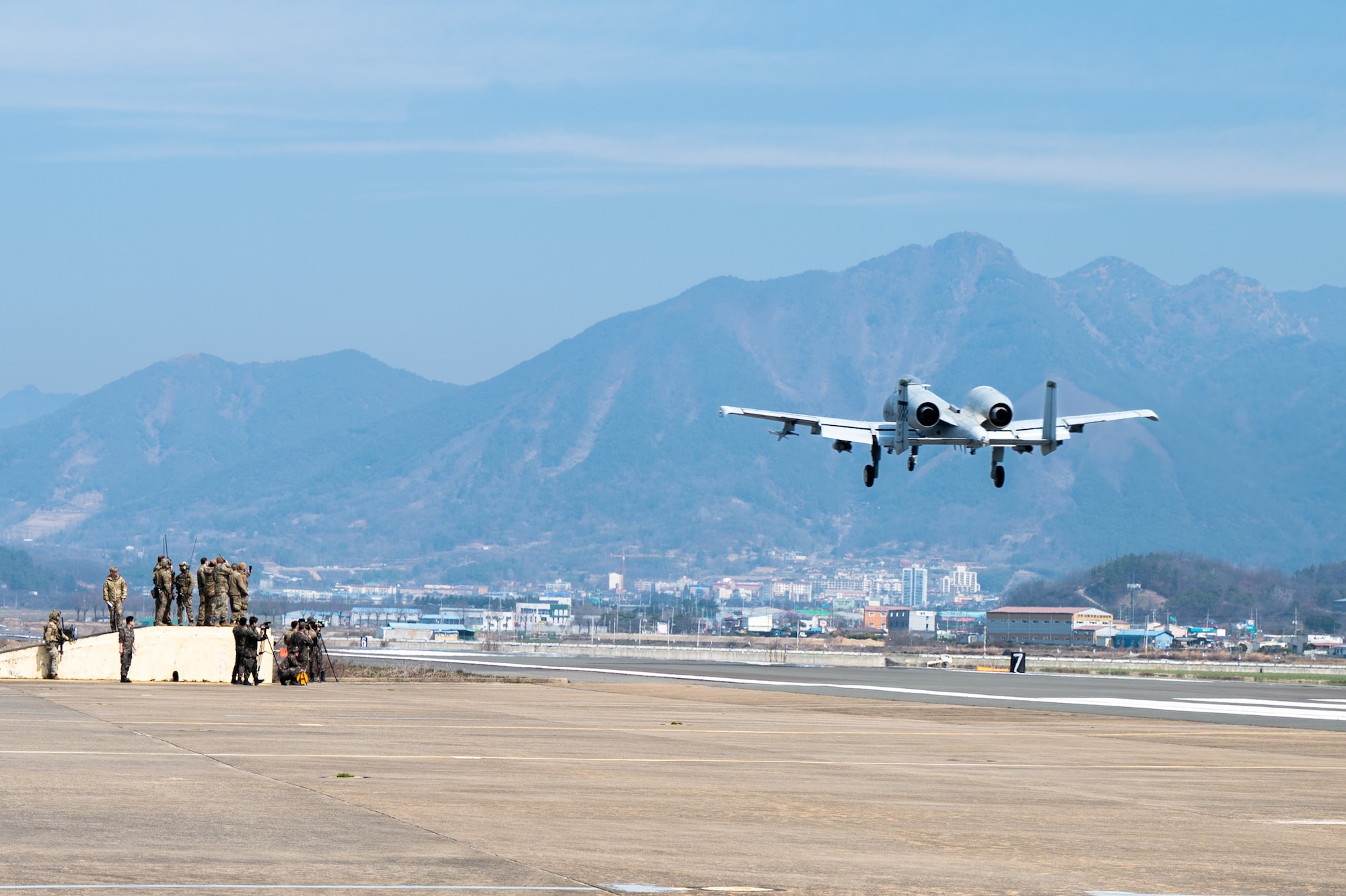A U.S. Air Force A-10 Thunderbolt II assigned to the 25th Fighter Squadron flies over an emergency landing strip during routine training at Namji, Republic of Korea, March 13, 2024. The training brought together U.S. Army, Air Force, and Republic of Korea Air Force service members to train on agile combat employment capabilities. Mission ready Airmen of the 51st FW play a pivotal role in enabling ACE, allowing for rapid aircraft deployment and versatile operations from austere locations, ultimately enhancing the ability to respond effectively to dynamic mission requirements in contested environments. (U.S. Air Force photo by Senior Airman Brittany Russell)