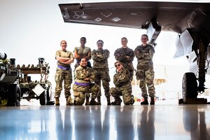 U.S. Air Force Luke Air Force Base weapon specialists pose for a photo following an all-women weapons load competition.