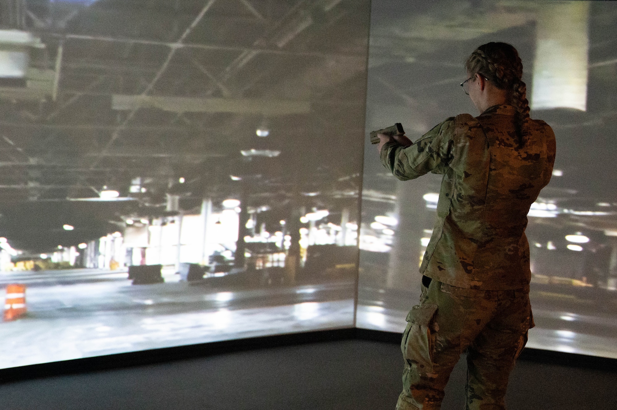Natalia Lundquist, Air Force ROTC cadet, gets hands-on experience during a 3-D virtual shooting exercise at Altus Air Force Base, Oklahoma, March 15, 2024. Lundquist expressed interest in the security forces career path after graduating. (U.S. Air Force photo by Airman 1st Class Heidi Bucins)