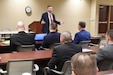 Robert W. Matthews, chief of the Army CID Strategic Initiatives Group, updates members of the 200th Military Police Command.