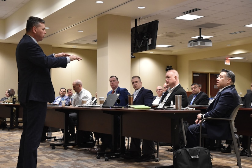 Robert W. Matthews, chief of the Army CID Strategic Initiatives Group, updates members of the 200th Military Police Command.