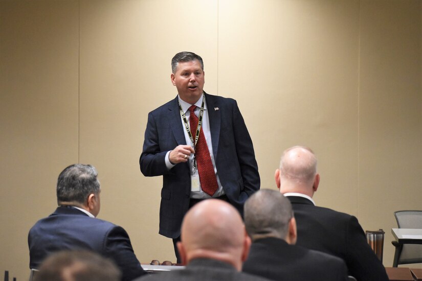 Robert W. Matthews, chief of the Army CID Strategic Initiatives Group, updates members of the 200th Military Police Command.