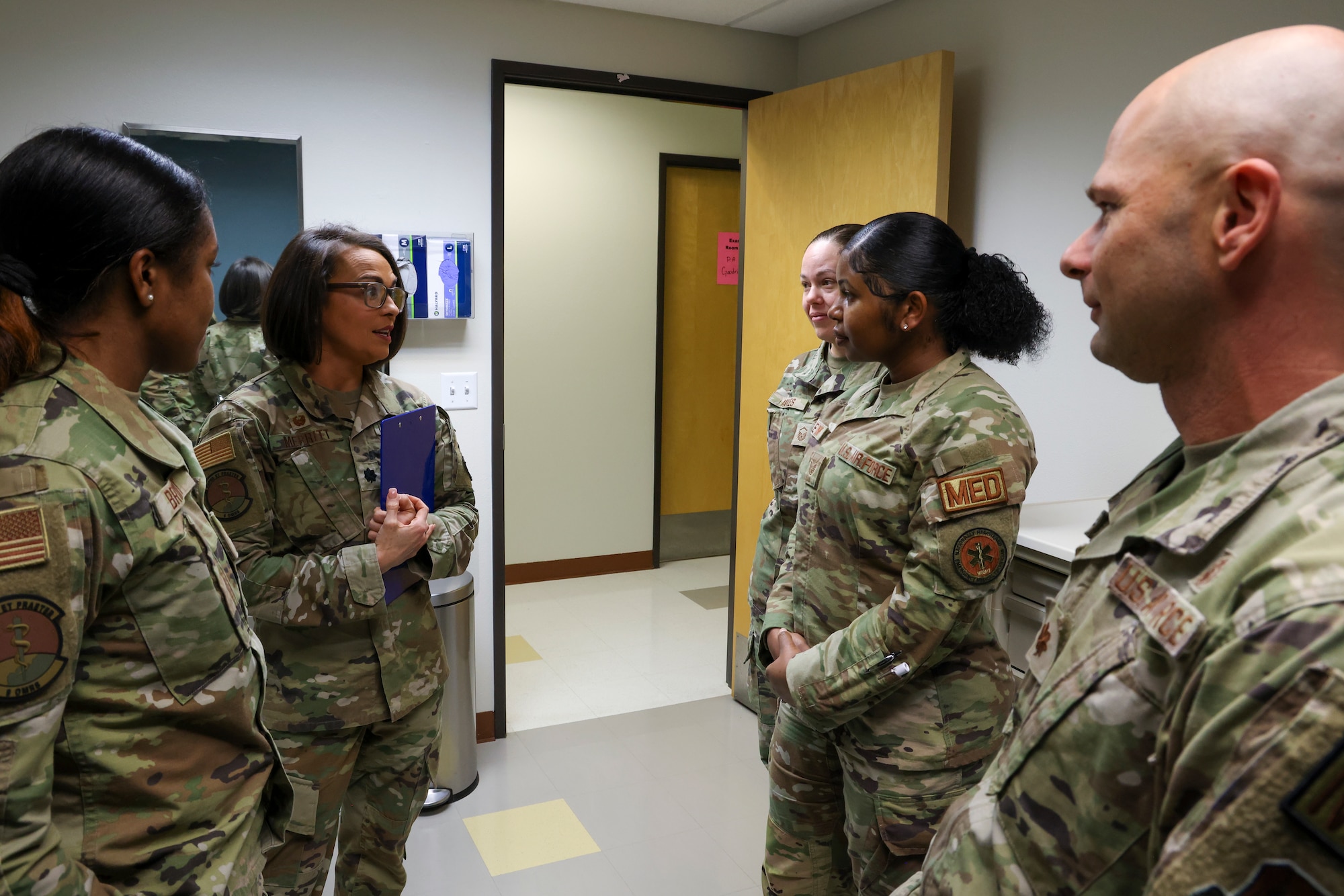 U.S. Air Force Lt. Col. Danielle Merritt, 9th Operational Medical Readiness Squadron commander, consults with airmen of the 9th Medical Group active-duty clinic at Beale Air Force Base, California, March 1 2024.