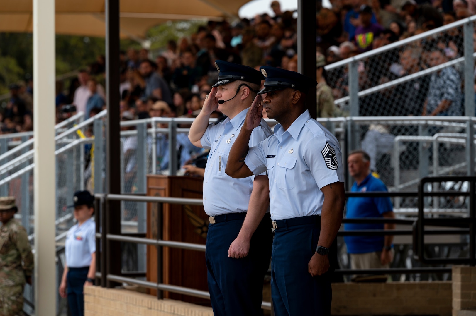 Col. Power and Chief Cooper are seen saluting