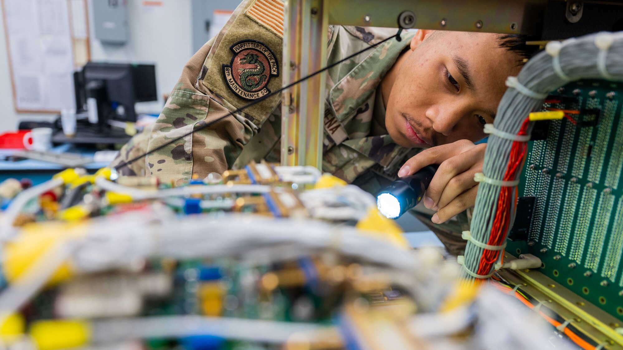 Airman 1st Class Thomas Dela Pena inspects equipment.