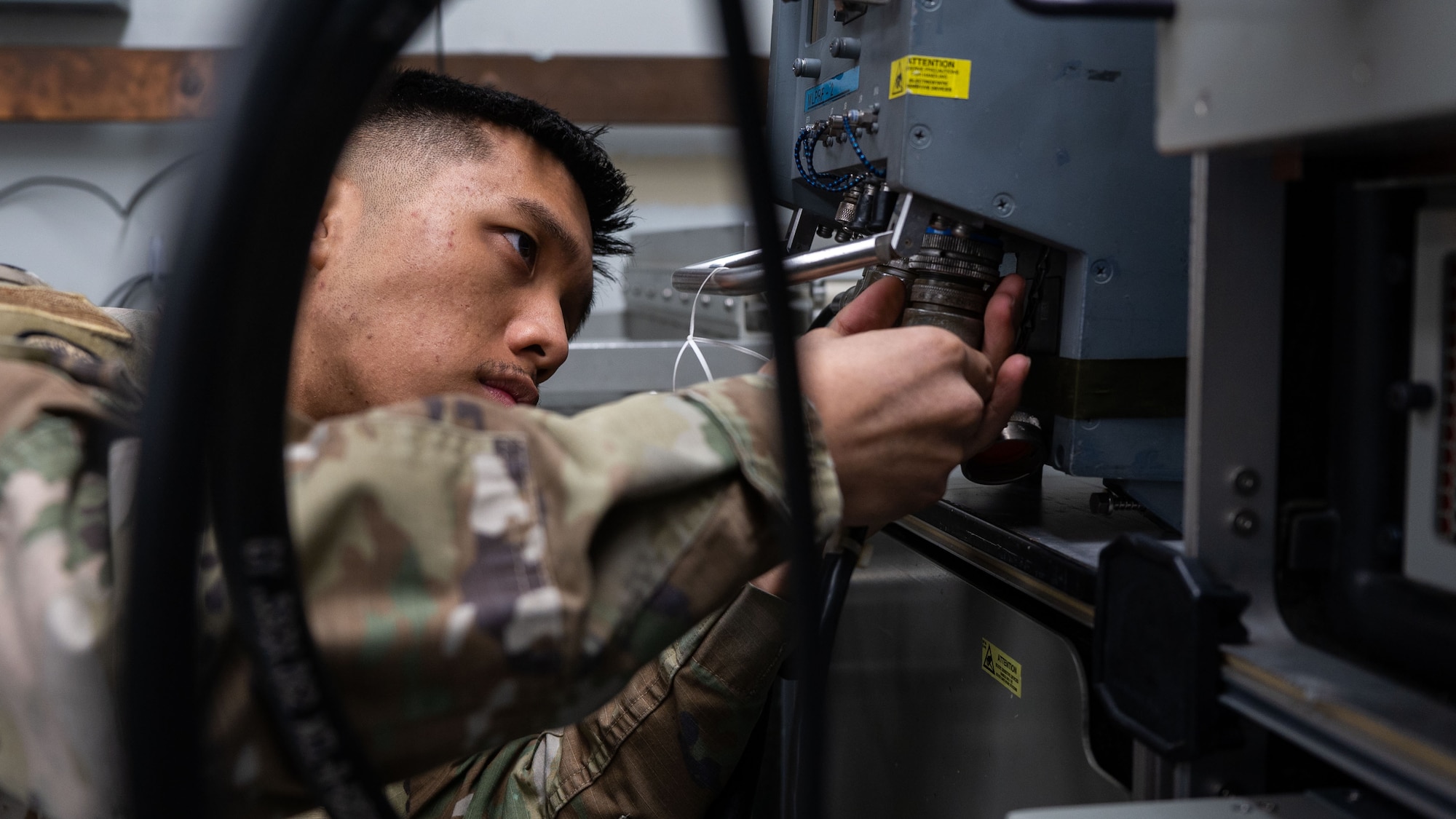 Airman 1st Class Thomas Dela Pena prepares equipment.