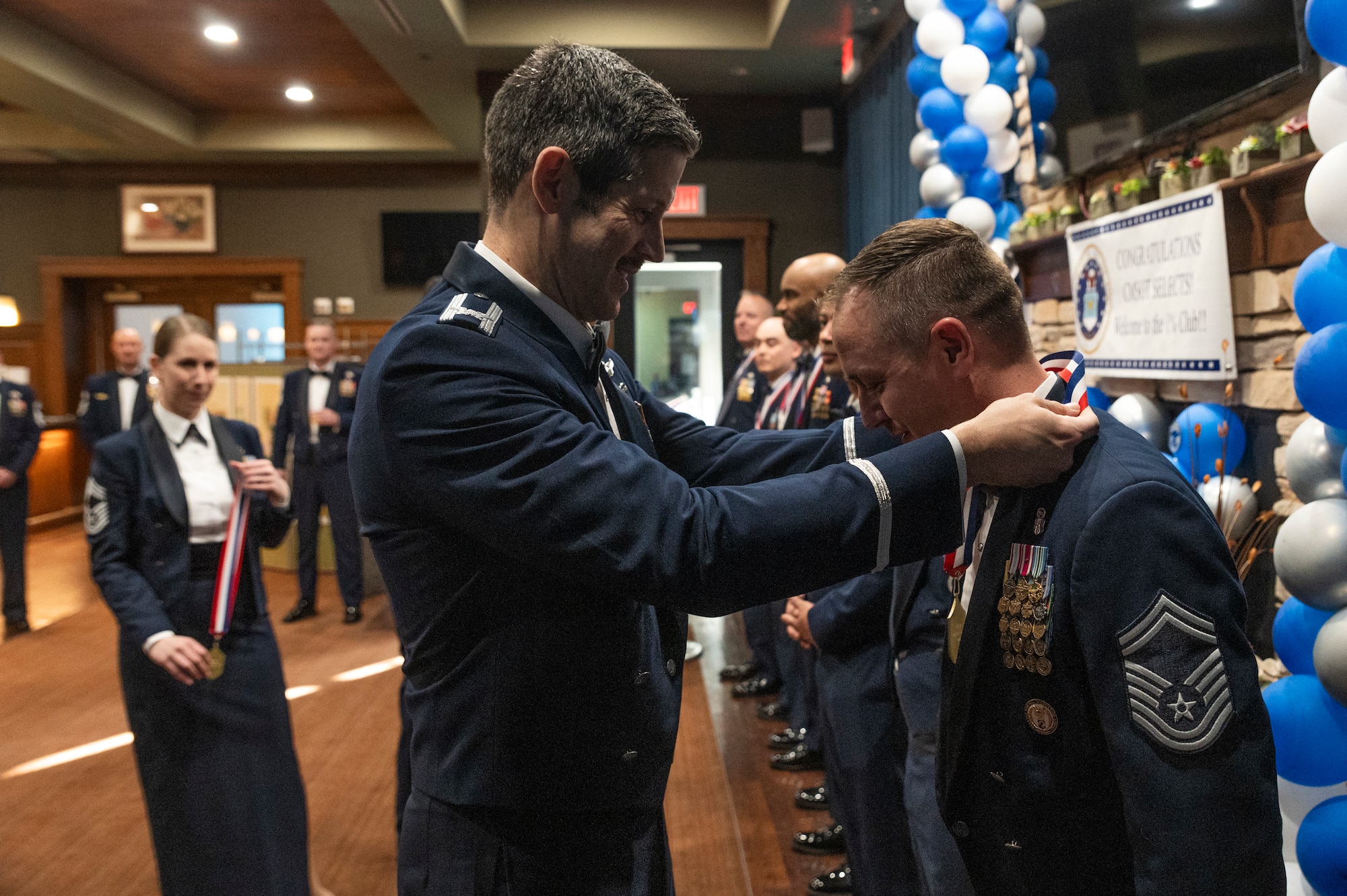 U.S. Air Force Col. William McKibban, 51st Fighter Wing commander, places a medallion around Senior Master Sgt. Matthew Scully, 51st Healthcare Operations Squadron senior enlisted leader, during the 51st FW Chief Recognition Ceremony at Osan Air Base, Republic of Korea, March 15, 2024.