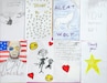 An image of drawings and cards of thanks from the students of Netzaberg Elementary School (DoDEA-Europe) that were presented to Army CID Special Agents Nicholas Wolf and Ryan Heller.