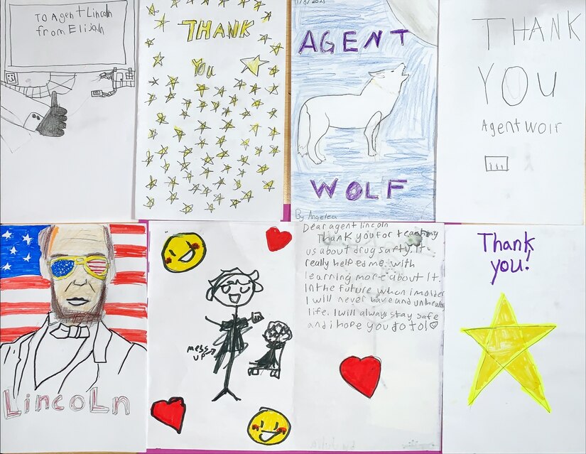 An image of drawings and cards of thanks from the students of Netzaberg Elementary School (DoDEA-Europe) that were presented to Army CID Special Agents Nicholas Wolf and Ryan Heller.