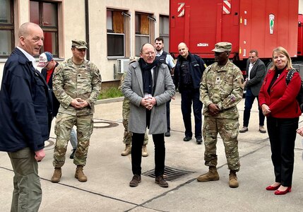 Mannheim Lord Mayor Christian Specht (middle) stands between Lt. Col. Omar McKen, the commander of Army Field Support Battalion-Poland, and Lt. Col. David Castillo, the U.S. Army Garrison Rheinland-Pfalz director of emergency services, during Specht’s site visit to the Coleman Army Prepositioned Stocks-2 worksite in Mannheim, Germany, March 15. The Lord Mayor visited the worksite to observe APS-2 operations and gain a clear understanding of the upcoming infrastructure upgrades and the associated economic, environmental and social impacts on the area. (Photo by Chris Maestas, USAG Rheinland-Pfalz PAO)