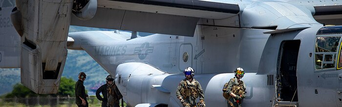 U.S. Marines with Marine Medium Tilt-Rotor Squadron (VMM) 265 perform pre-flight procedures on an MV-22B Osprey during Marine Aviation Support Activities 22-2, July 18, 2022, Subic Bay, Philippines.