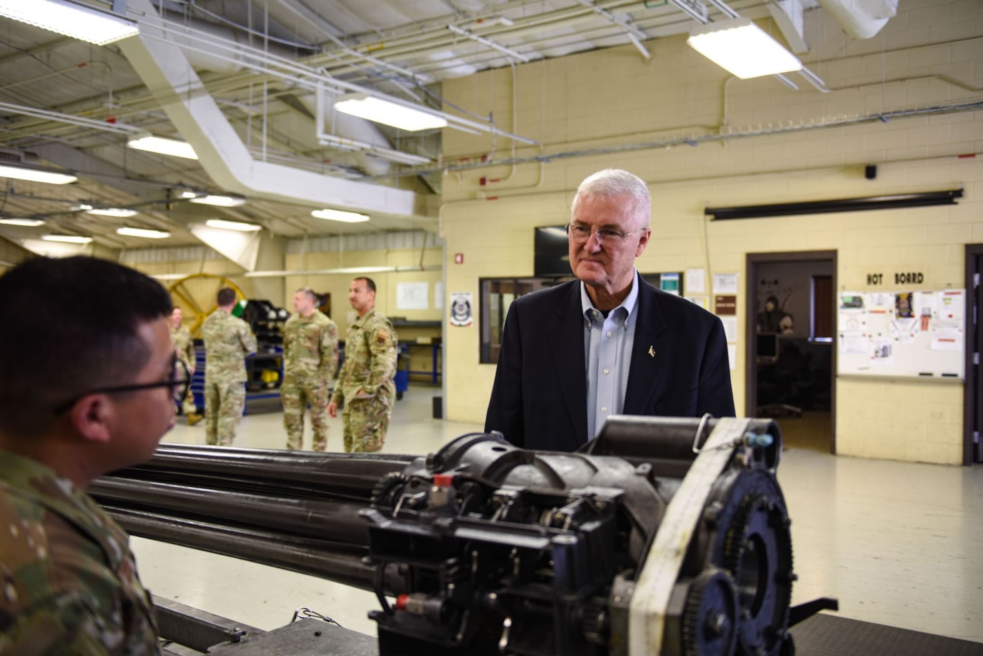 Chief Master Sgt. of the Air Force (ret.) Gerald R. Murray is shown a GAU-8/A Avenger Gatling gun at the 74th Maintenance Group weapons unit at Moody Air Force Base, Georgia, March 15, 2023. Gatling guns are the standard issue weapon attached to the A-10C Thunder ll and can fire around 3,900 rounds-a-minute. (U.S. Air Force photo by Airman 1st Class Sir Wyrick)