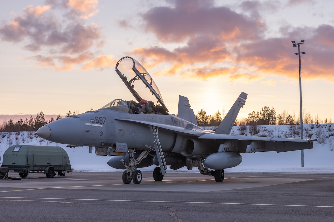 U.S. Marines with Marine Fighter Attack Squadron (VMFA) 312, 2nd Marine Aircraft Wing (MAW), stage in a U.S. Marine Corps F/A-18D Hornet after landing in preparation for distributed aviation operations (DAO) during Exercise Nordic Response 24 at Oulu, Finland, March 9, 2024. Exercise Nordic Response is an opportunity for the 2nd MAW to refine the DAO warfighting concept, which focuses on generating aviation combat power through the dispersion of aviation squadrons, command-and-control agencies, aviation logistics, and aviation ground-support units across the battlefield while integrating with allies and partners. Exercise Nordic Response 24 is designed to enhance military capabilities and allied cooperation in high-intensity warfighting scenarios under challenging arctic conditions, while providing U.S. Marines unique opportunities to train alongside NATO allies and partners. (U.S. Marine Corps photo by Cpl. Christopher Hernandez)