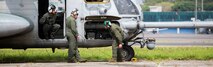 U.S. Marines with the Aviation Combat Element, Special Purpose Marine Air-Ground Task Force - Southern Command, check over their CH-53E Super Stallion helicopter before departing  La Aurora International Airport in Guatemala City, Guatemala, Aug. 1, 2017.