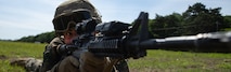 Marine Solider in training holding a rifle.