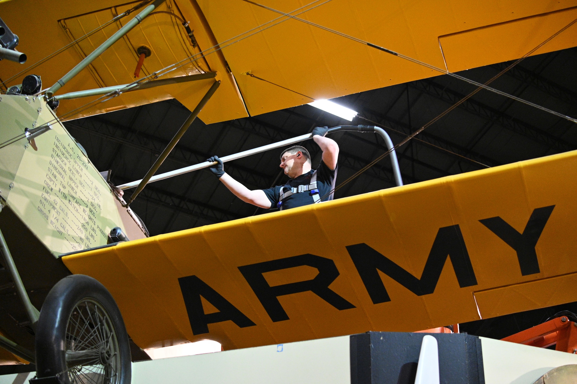 Nick Almeter cleans the Consolidated PT-1 Trusty aircraft.