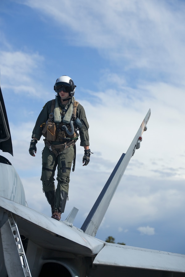 U.S. Marine Corps Capt. Michael Logrande, a student weapons systems officer with Marine Fighter Attack Squadron (VMFA) 323, Marine Aircraft Group 11, 3rd Marine Aircraft Wing, conducts preflight checks on an F/A-18D Hornet assigned to VMFA-323 before a section engaged maneuvering flight at Marine Corps Air Station Miramar, California, March 18, 2024. LoGrande conducted his final student flight with VMFA-323's Fleet Readiness Detachment before graduating on March 22, 2024, as the Marine Corps last WSO. (U.S. Marine Corps photo by Sgt. Sean Potter)