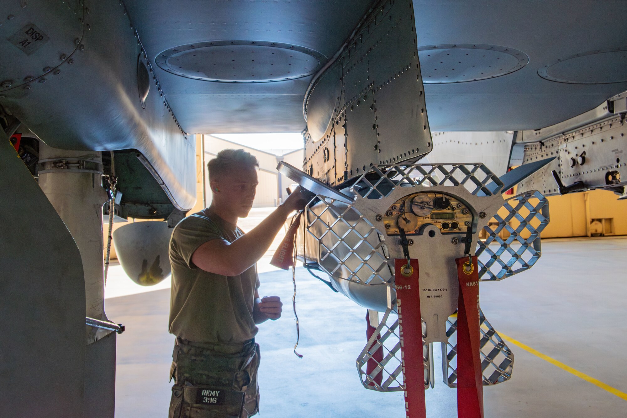 U.S. Air Force Airman 1st Class Kyler Stenke, 74th Fighter Generation Squadron load crew member, inspects the fasteners on a Miniature Air-Launched Decoy at Moody Air Force Base, Georgia, Feb. 14, 2024. After finishing the training, the load crew received a report on their efficiency and performance as a team. (U.S. Air Force photo by Airman 1st Class Sir Wyrick)
