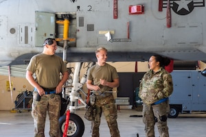 From left, U.S. Air Force Staff Sgt. Concepcion Rodelo, Airman 1st Class Kyler Stenke, and Senior Airman Anisa Price, 74th Fighter Generation Squadron load crew, discuss training at Moody Air Force Base, Georgia, Feb. 14, 2024. Load crews are made up of three members and are responsible for loading weapons and munitions on a designated aircraft. (U.S. Air Force photo by Airman 1st Class Sir Wyrick)