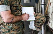 U.S. Marine Corps Gunnery Sgt. Jeremy J. Toteno, battery gunnery sergeant with Golf Battery, 3rd Battalion, 14th Marine Regiment, writes down notes during a mock inspection of hazard identification in the Ground Safety for Marines (GSM) Course on Marine Corps Base Camp Lejeune, North Carolina, April 24, 2023.