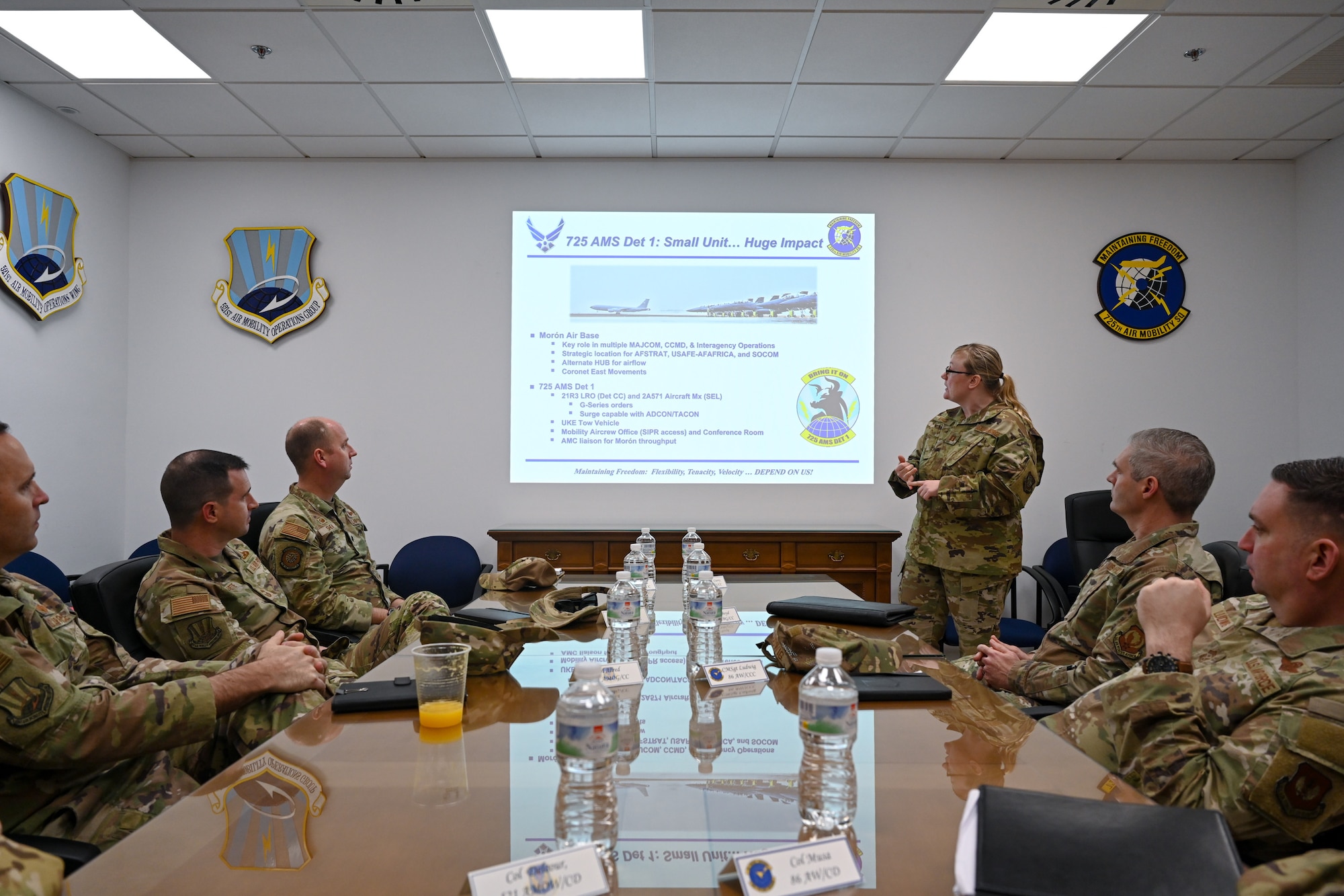 Capt. Rebecca Roach, 725th Air Mobility Squadron Detachment 1 commander, briefs distinguished visitors on what the 725 AMS Det 1’s mission is during Exercise Rising Phoenix, Feb. 7, 2024, at Morón Air Base, Spain.