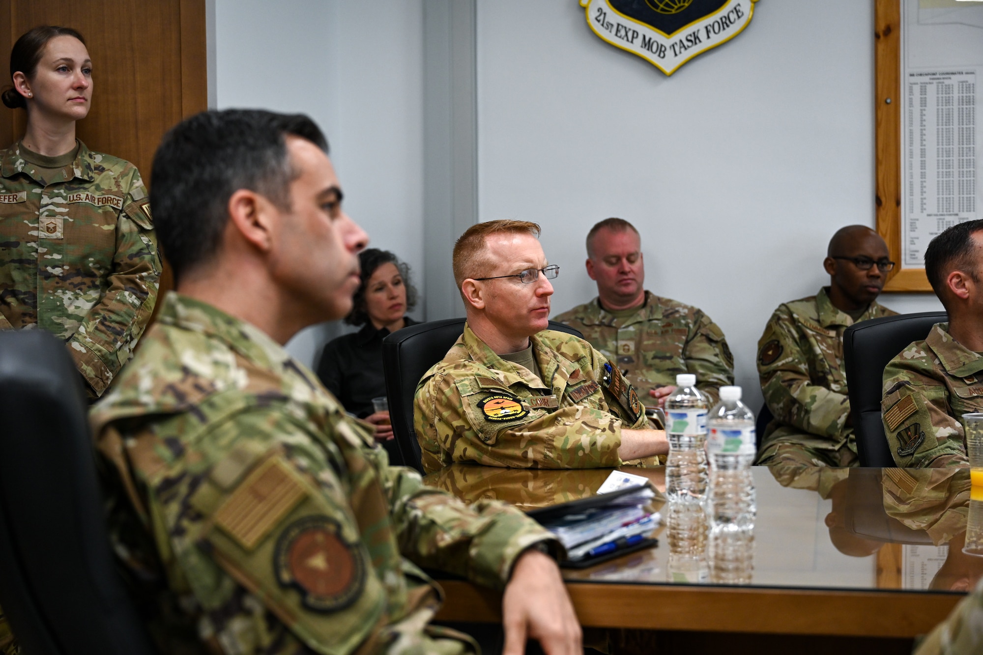 Col. Nicholas Delcour, center, 521st Air Mobility Operations Wing deputy commander, and Col. Jamil Musa, left center, 86th Airlift Wing deputy commander, listen to a brief about Exercise Rising Phoenix, Feb. 7, 2024, at at Morón Air Base, Spain.