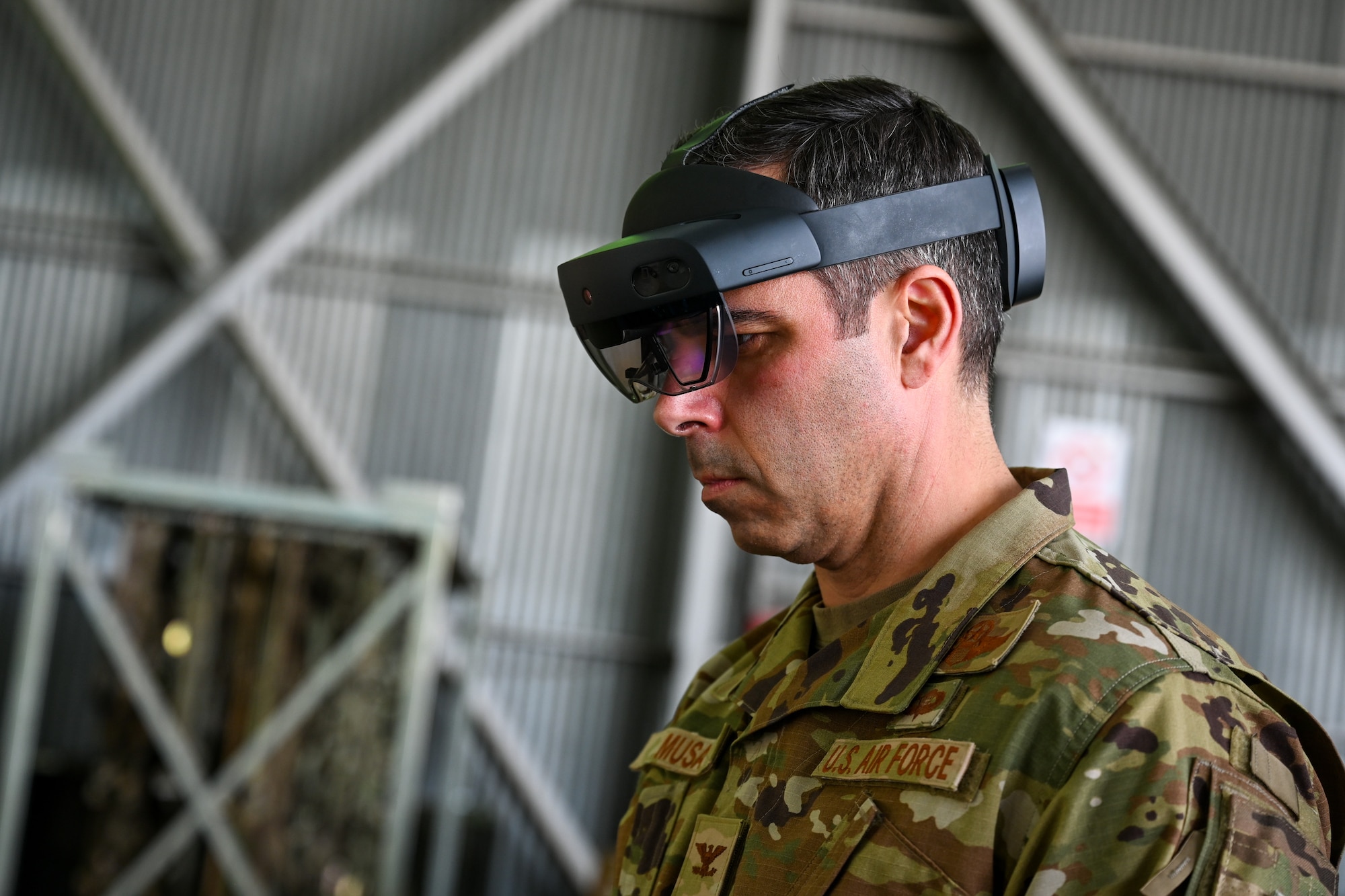 A HoloLens headset hangs from the hands of a U.S. Air Force service member during Exercise Rising Phoenix, Feb. 7, 2024, at Morón Air Base, Spain.