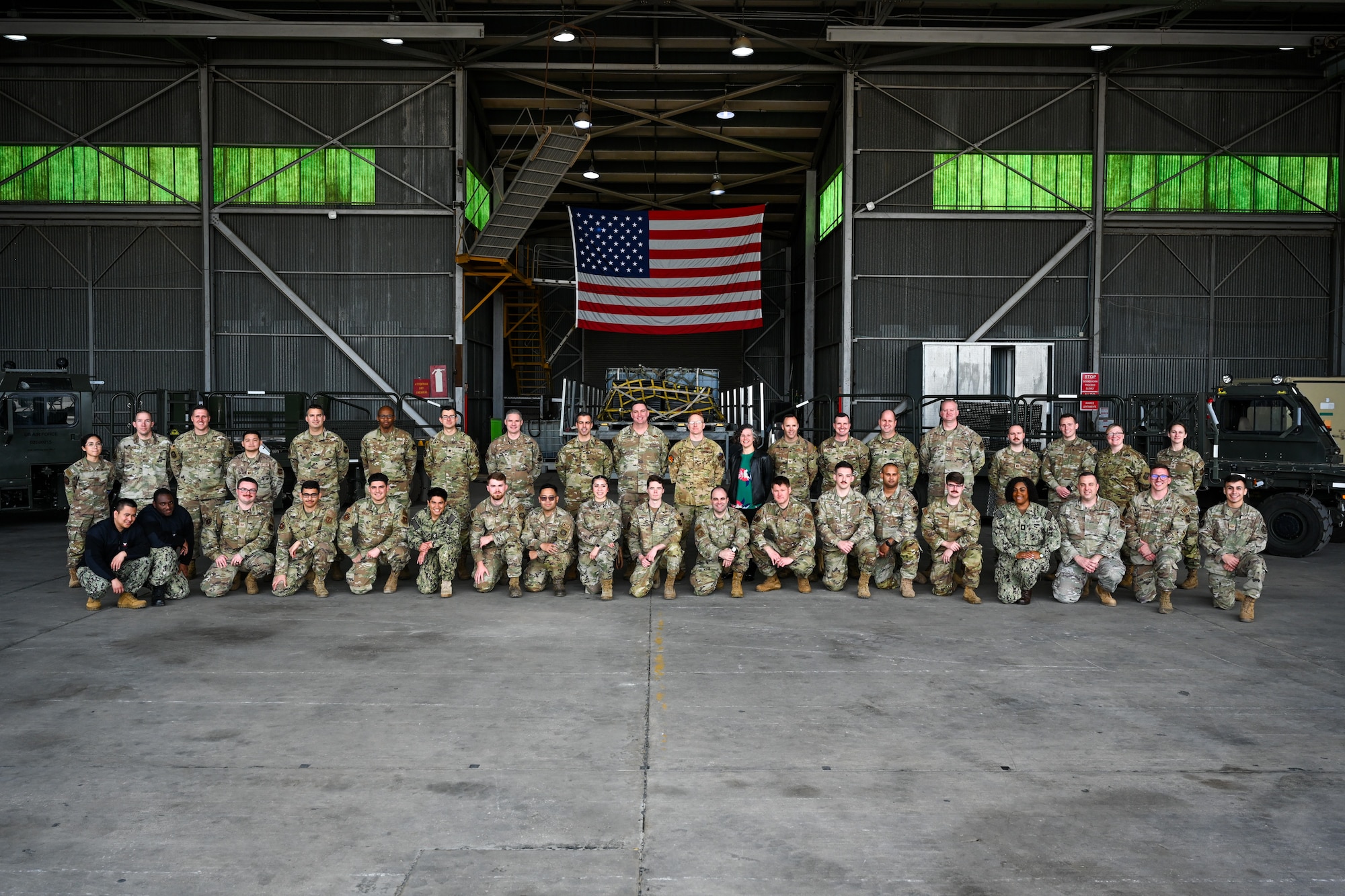Distinguished visitors and members participating in Exercise Rising Phoenix pose for a group photo Feb. 7, 2024, at Morón Air Base, Spain.