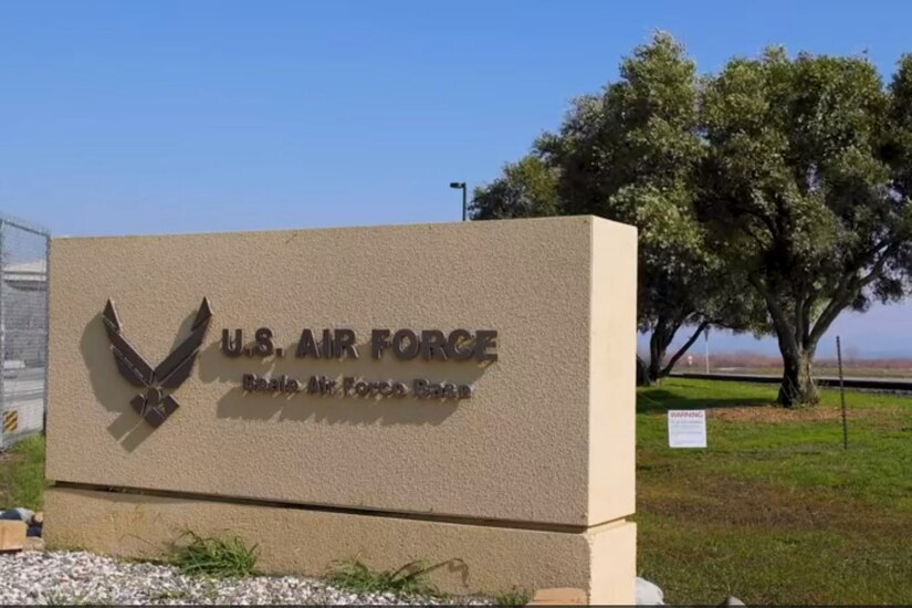 A stone entry sign that says "U.S. Air Force Beal Air Force Base" with the Air Force insignia and trees in the backdrop.