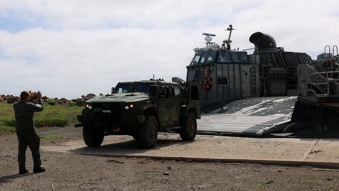 U.S. Marines with Marine Wing Support Squadron 373, Marine Air Control Group 38, 3rd Marine Aircraft Wing, and U.S. Navy Sailors with Assault Craft Unit 5, load a U.S. Marine Corps joint light tactical vehicleon a U.S. Navy Landing Craft, Air Cushion assigned to ACU 5, for transport from San Clemente Island to Camp Pendleton, California, Feb. 28, 2024. ACU 5 helped transport 835,000 pounds of equipment across 58 nautical miles in support of MWSS-373's Strategic Mobility Exercise (STRATMOBEX) II. During STRATMOBEX II, MWSS-373 demonstrated mastery of scalable air-ground support such as expeditious airfield damage repair, forward arming and refueling, integrated engineering, and explosive ordnance disposal operations. (U.S. Marine Corps photo by Lance Cpl. Samantha Devine)