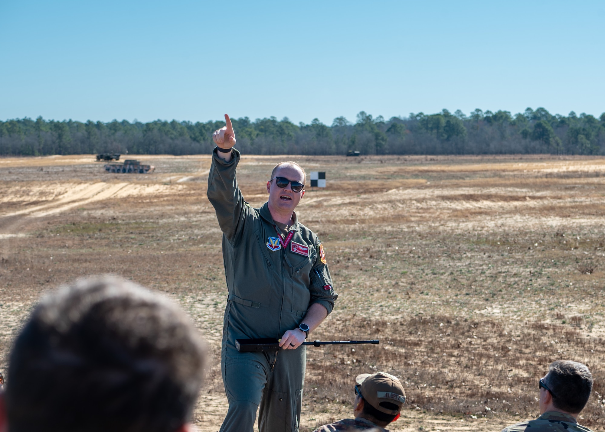 A man points to the sky.