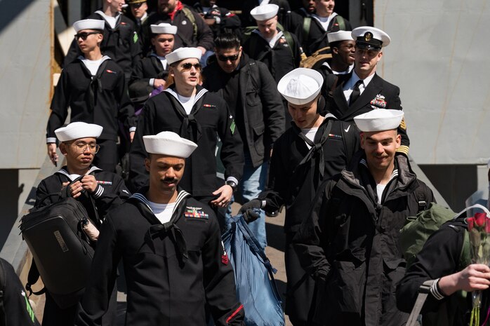 Sailors depart the Wasp-class amphibious assault ship USS Bataan (LHD 5)