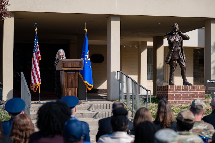 Judith Harding, granddaughter of Joint Base Anacostia-Bolling’s namesake, provides remarks about her grandfather during his statue unveiling ceremony at JBAB, Washington, D.C., Nov. 9, 2023. The late U.S. National Guard Col. Raynal C. Bolling is remembered for creating the first flying units in what would become the Air National Guard, as well as his many contributions to the war effort during World War I. The U.S. Army honored the fallen aviator in 1918 by naming the National Capital Region’s newest aviation facility Bolling Field, which would later become Bolling Air Force Base and then JBAB. (U.S. Air Force photo by Kristen Wong)