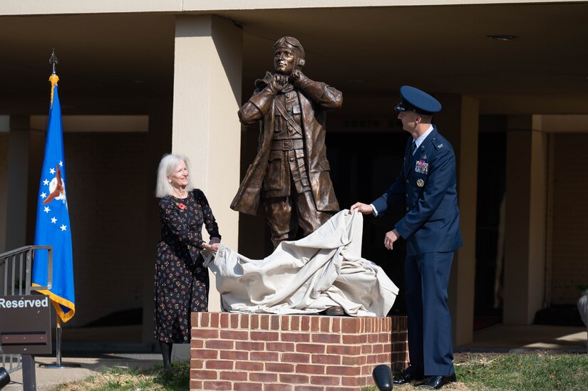 U.S. Air Force Col. Ryan A. F. Crowley, right, commander of Joint Base Anacostia-Bolling and the 11th Wing, and Judith Harding, granddaughter of JBAB’s namesake, unveil a statue of U.S. National Guard Col. Raynal C. Bolling during an unveiling ceremony, at JBAB, Washington, D.C., Nov. 9, 2023. Bolling is remembered for creating the first flying units in what would become the Air National Guard, as well as his many contributions to the war effort during World War I. The U.S. Army honored the fallen aviator in 1918 by naming the National Capital Region’s newest aviation facility Bolling Field, which would later become Bolling Air Force Base and then JBAB. (U.S. Air Force photo by Kristen Wong)