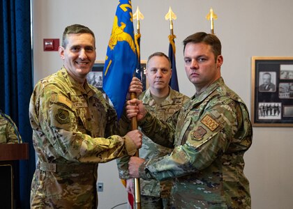 U.S. Air Force Lt. Col. Joshua Jessup, right, outgoing commander of 224th Air Defense Group Detachment 1, relinquishes command to U.S. Air Force Col. Steven Rathmell, left, commander of the 224th Air Defense Group, during a change of command ceremony at the Bolling Club in Joint Base Anacostia-Bolling, Washington, D.C., Jan. 17, 2024. Detachment 1 is charged with providing direct operational support to the Air Missile Defense Task Force and overseeing air operations in the National Capital Region. (U.S. Air Force photo by Airman 1st Class Bill Guilliam)