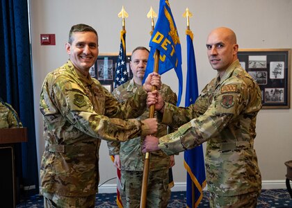 U.S. Air Force Col. Steven Rathmell, left, commander of the 224th Air Defense Group, bestows the guidon upon U.S. Air Force Lt. Col. Eric Miller, right, incoming commander of 224th ADG Detachment 1, during a change of command ceremony at the Bolling Club in Joint Base Anacostia-Bolling, Washington, D.C., Jan. 17, 2024. Joint Air Defense Operations Center, which has been a tenant of JBAB since 2003, has had several National Guard units rotate into the National Capital Region over the years to serve in defense of the nation’s capital. (U.S. Air Force photo by Airman 1st Class Bill Guilliam)