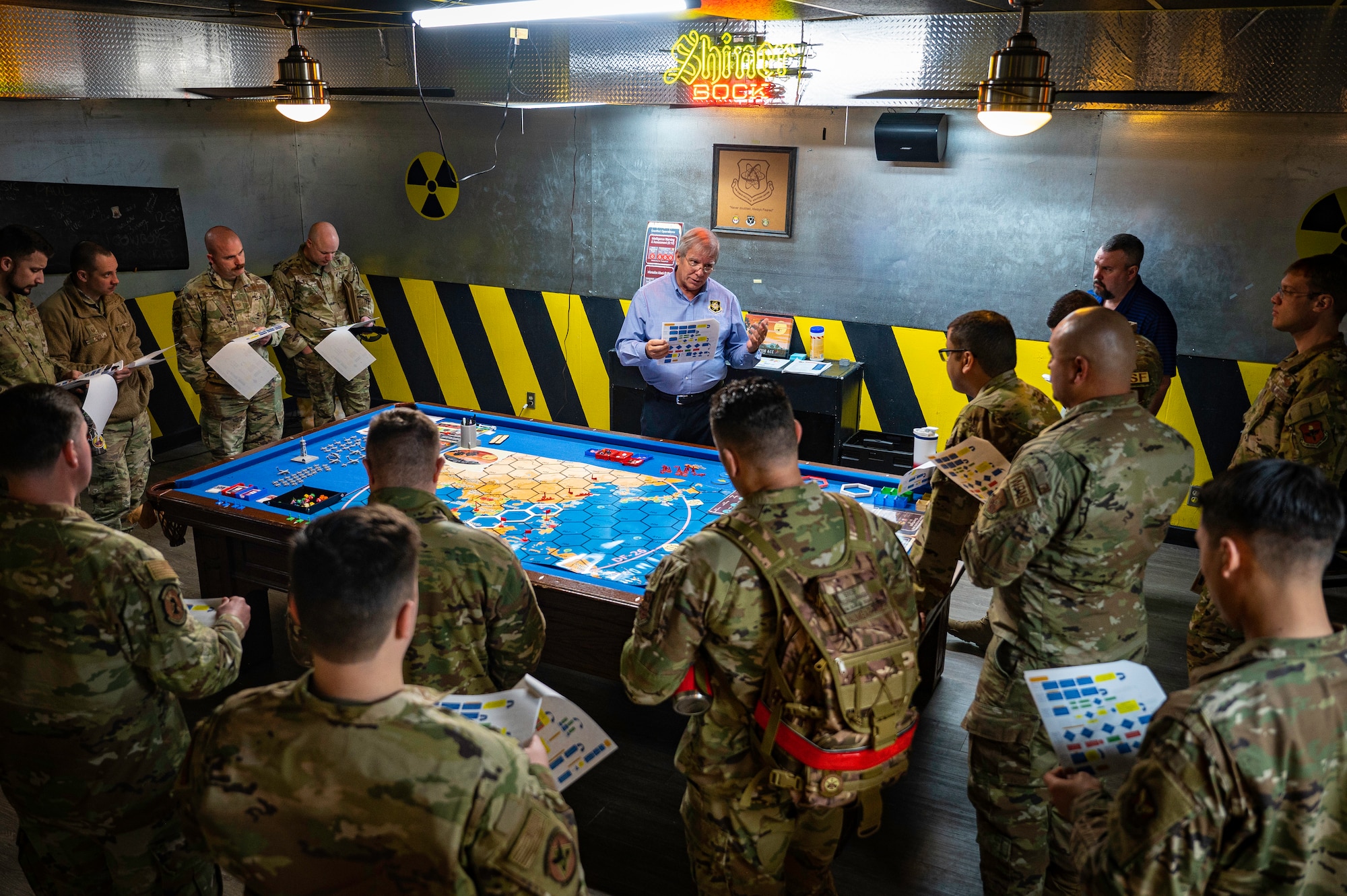 Men have a conversation around game board.