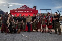 U.S. Marines with Recruiting Station San Diego, 12th Marine Corps District, alongside Cpl. Sarah Grawcock, a combat photographer and mascot handler with Headquarters and Service Battalion, Marine Corps Recruit Depot San Diego, California, and Pfc. Bruno, the mascot of MCRD San Diego and the Western Recruiting Region, pose for a photo at Snapdragon Stadium in San Diego, March 16, 2024. The mascot's job is to boost morale, participate in outreach work and attend events and ceremonies. (U.S. Marine Corps photo by Sgt. Jesse K. Carter-Powell)