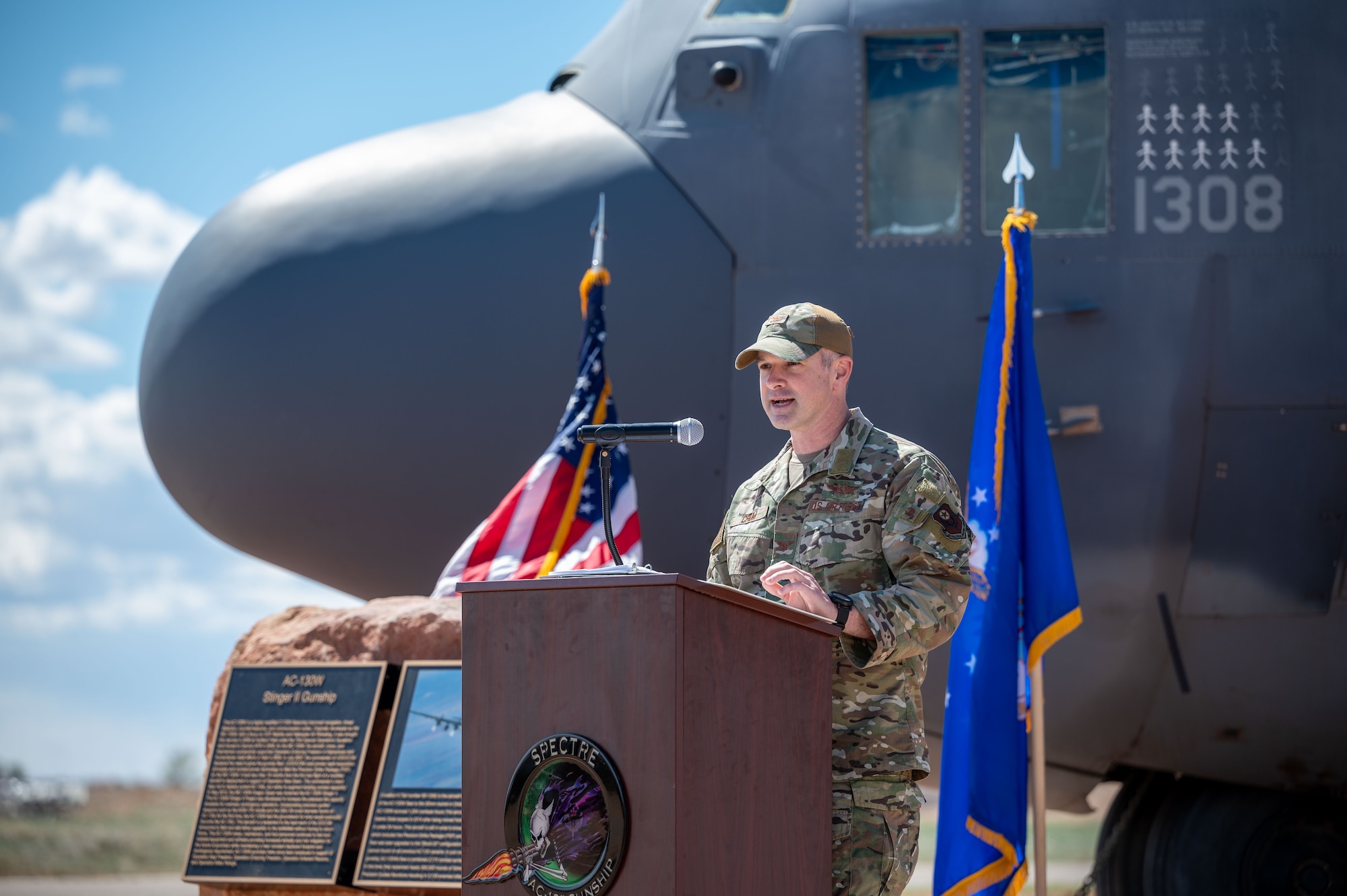 U.S. Air Force Col. Kaveri Crum, 1st Special Operations Wing Deputy Commander, gives a speech about the impacts of the AC-130W Stinger II gunship during the static display unveiling ceremony at Cannon Air Force Base, New Mexico, March 21, 2024. During the ceremony, Crum highlighted the many operations the AC-130Ws have flown and its history as an Air Force Special Operations Command asset. (U.S. Air Force photo by 2nd Lt. Charles Moye)