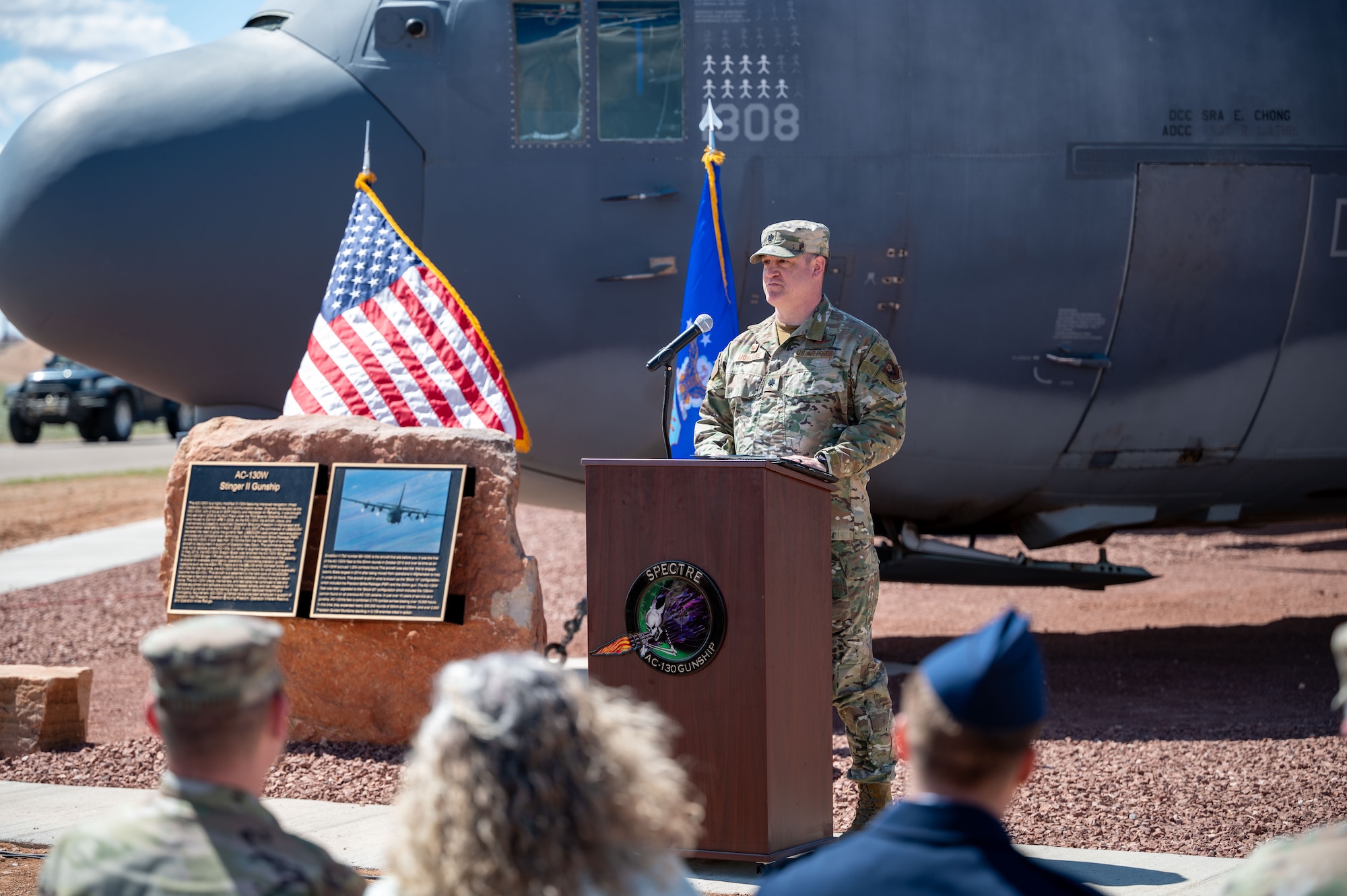 U.S. Air Force Lt. Col. Thomas Moncure, 16th Special Operations Squadron commander, discusses the history of the AC-130W Stinger II gunship during the static display unveiling ceremony at Cannon Air Force Base, New Mexico, March 21, 2024. The AC-130W flew its final combat mission as the last American forces departed Kabul, Afghanistan in August, 2021. (U.S. Air Force photo by 2nd Lt. Charles Moye)