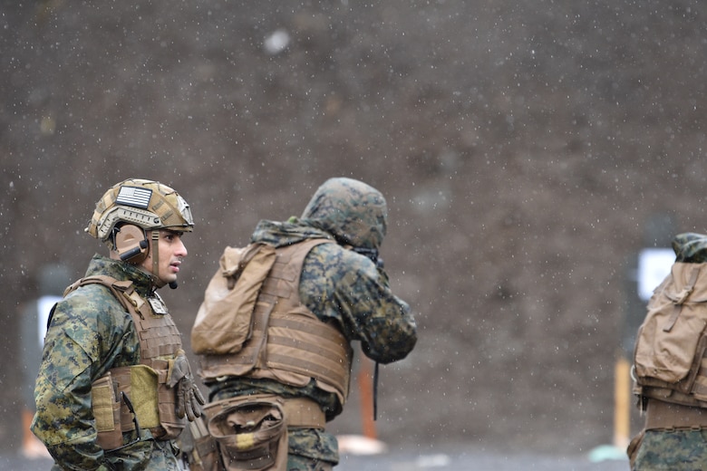 Sgt. Rinkesh Soni looks down the line of students during a patrol rifle course.