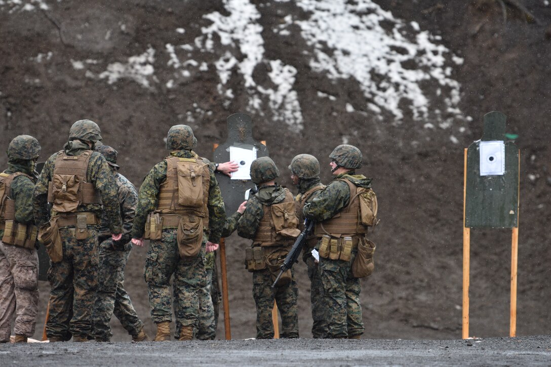 Marines assigned to Combined Arms Training Center, Camp Fuji, analyze a target during a patrol rifle course, March 12, 2024.  (U.S. Marine Corps photo by Song Jordan)