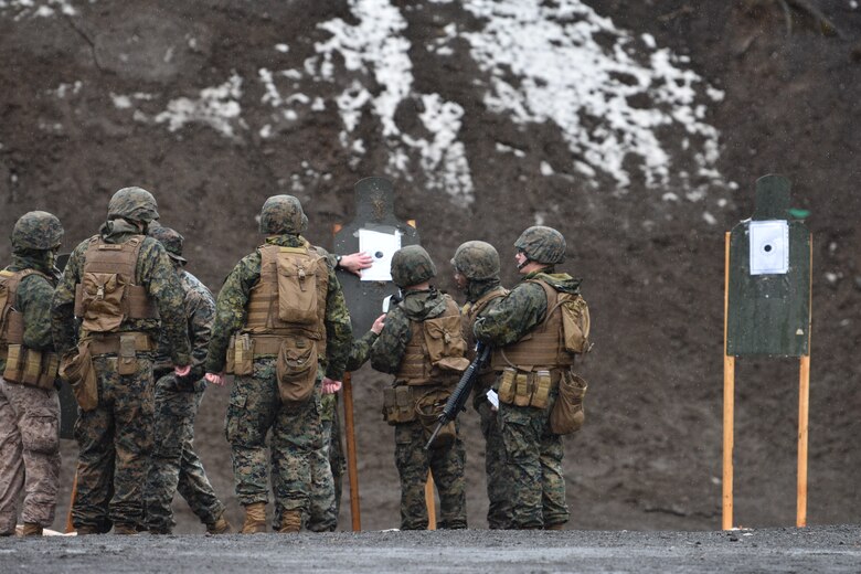 Marines analyzes a target during a patrol rifle course.