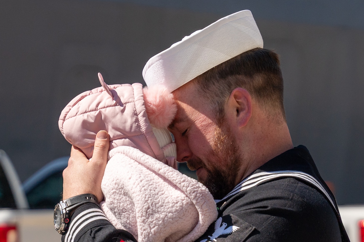MM2 Adam Huggins greets his family as USS Bataan (LHD 5) returns to Naval Station Norfolk.