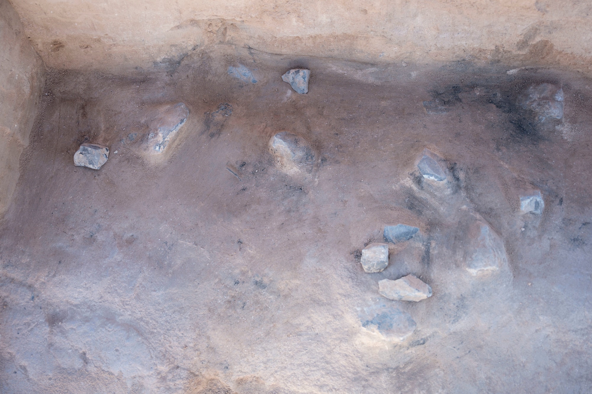 The remnants of an 8,200-year old hearth uncovered by the members of the 49th Civil Engineer Squadron environmental flight at Holloman Air Force Base, New Mexico, Mar. 7, 2024. The site named Gomolak Overlook is one of 400 documented sites on Holloman with each tied to a different archaeological period. (U.S. Air Force photo by Airman 1st Class Isaiah Pedrazzini)