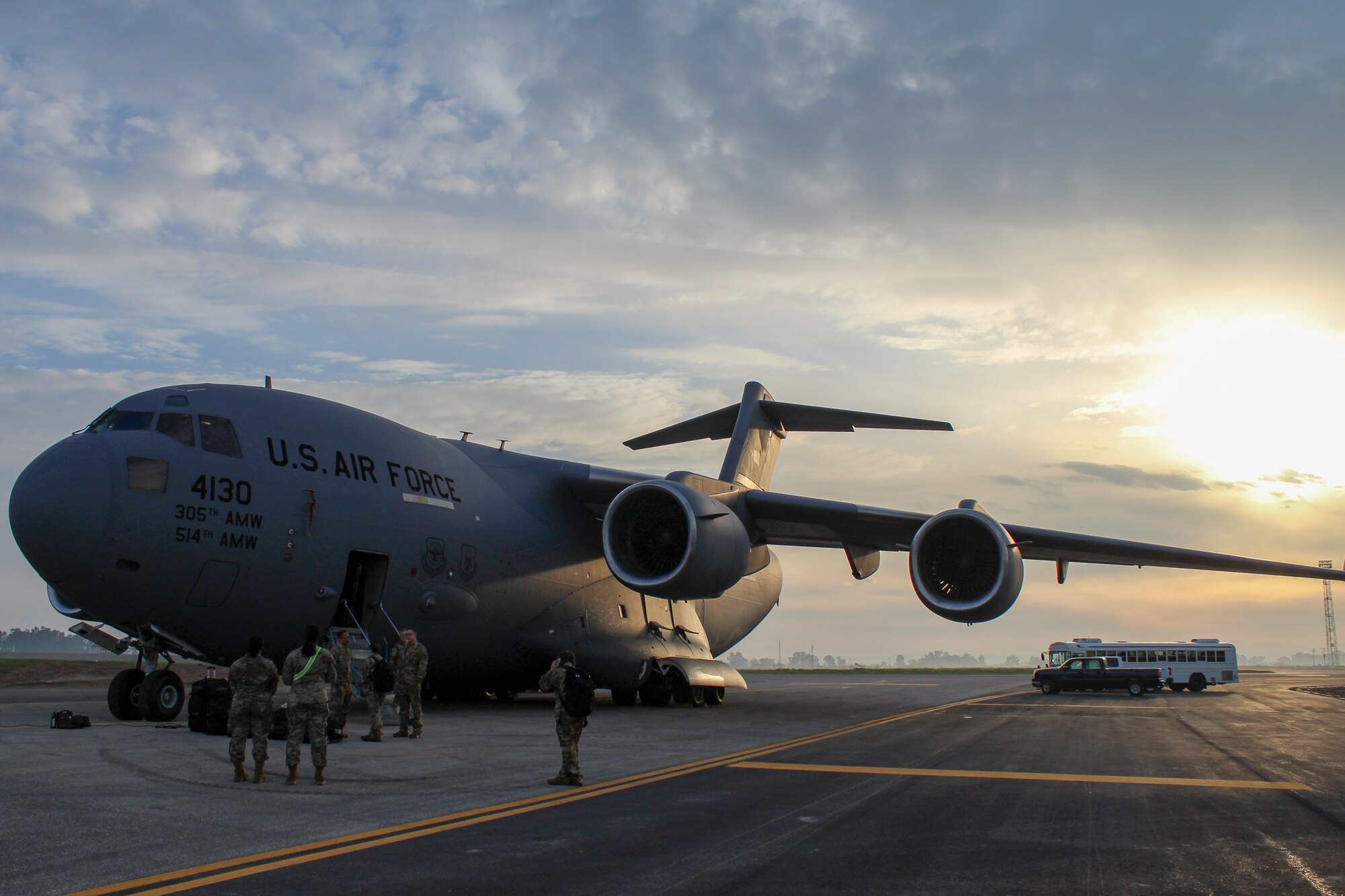 U.S. Air Force service members stand around a C-17 Globemaster III during Exercise Rising Phoenix, Feb. 6, 2024, at Morón Air Base, Spain.