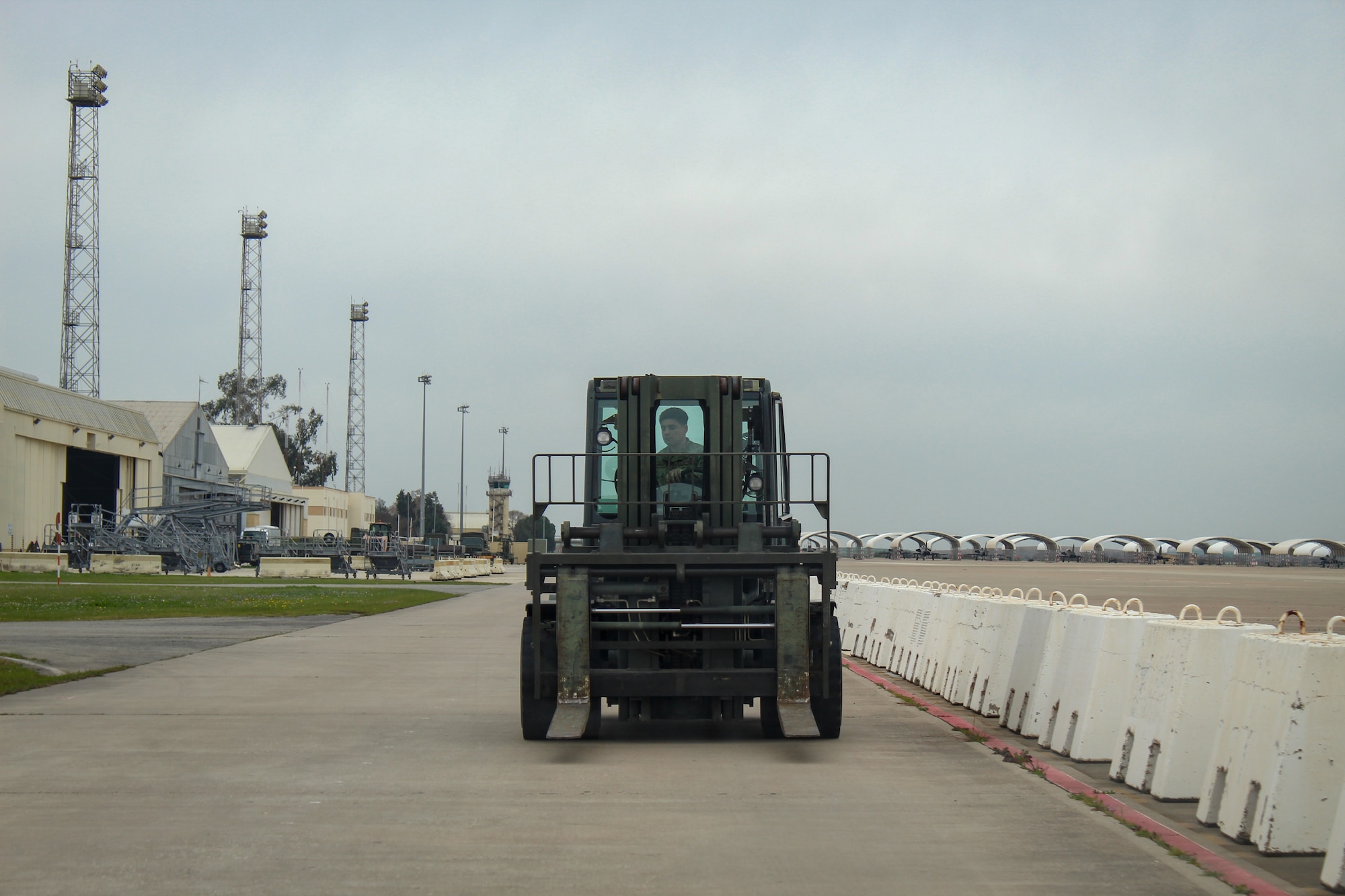 A U.S. Air Force service members drives a forklift during Exercise Rising Phoenix, Feb. 8, 2024, at Morón Air Base, Spain.