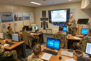 An Airman gives an introduction during an Aircraft Battle Damage Repair course